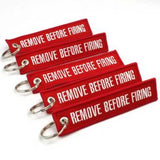 Remove Before Firing Keychain - Red/White