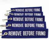 Remove Before Firing Keychain - Blue/White