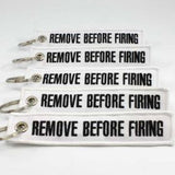 Remove Before Firing Keychain - White/Black