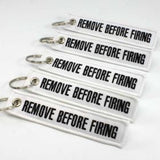 Remove Before Firing Keychain - White/Black